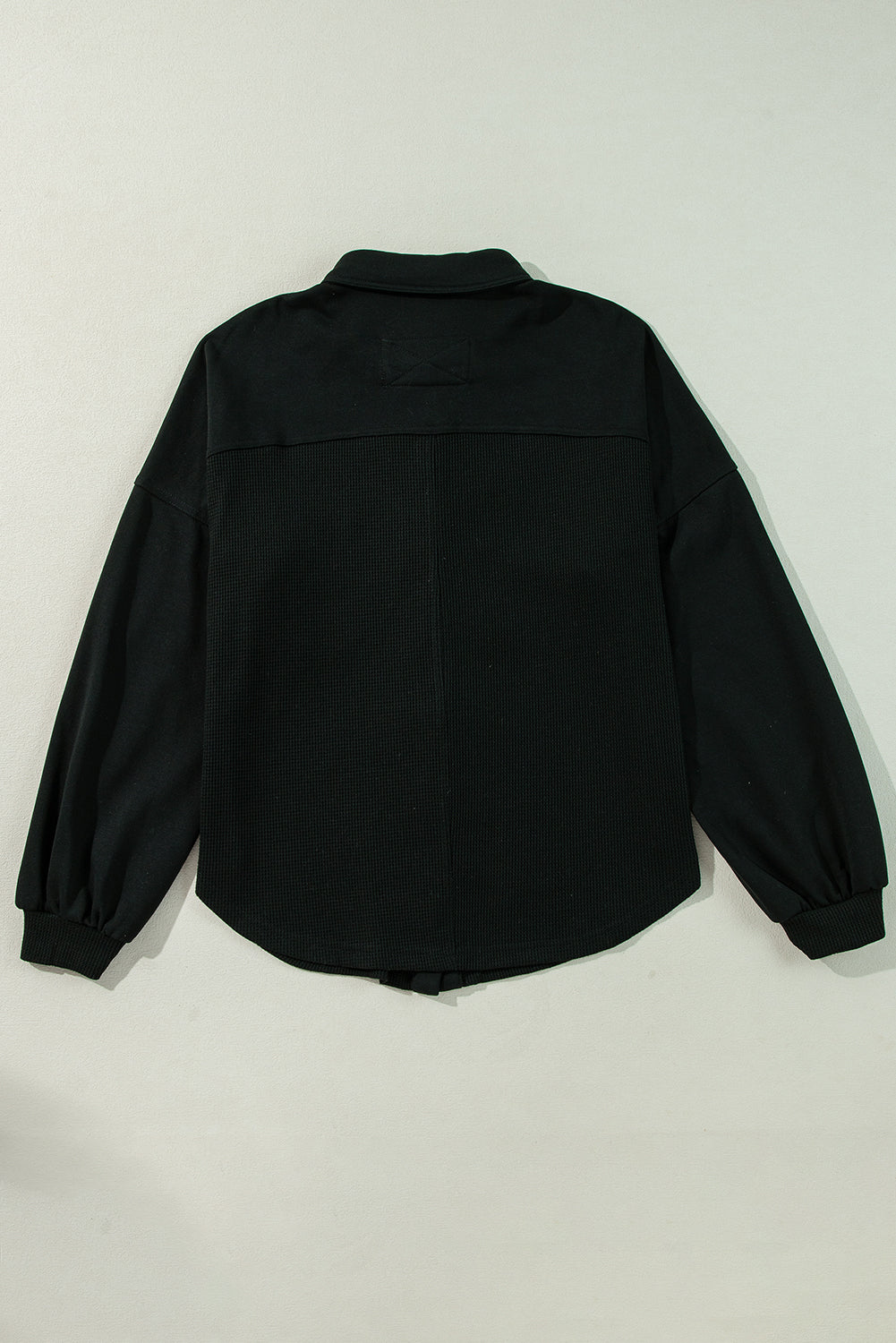 Veste surdimensionnée boutonnée en tricot gaufré noir