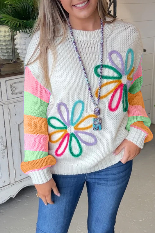 Crew neck sweater with color block sleeves and white floral pattern