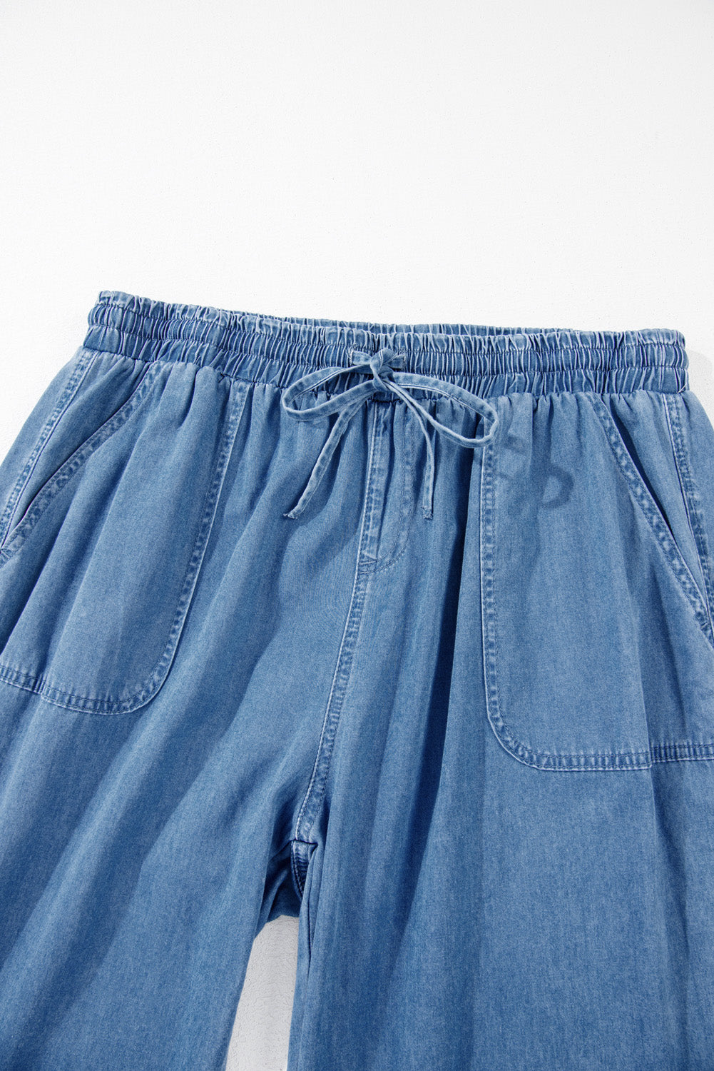 Dusk Blue Denim Jogger Pants with Waist Pockets and Oversized Drawstring