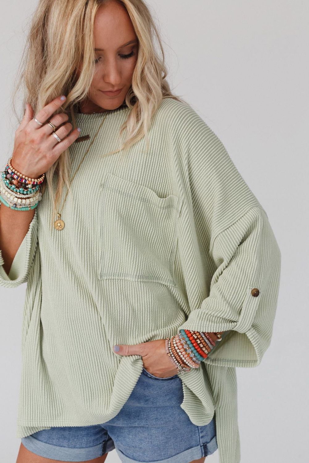 Green ribbed oversized top with rolled up sleeves and chest pocket