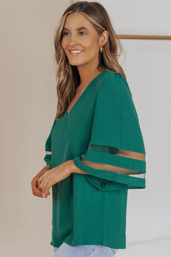 Green loose blouse with flared sleeve and v -collar