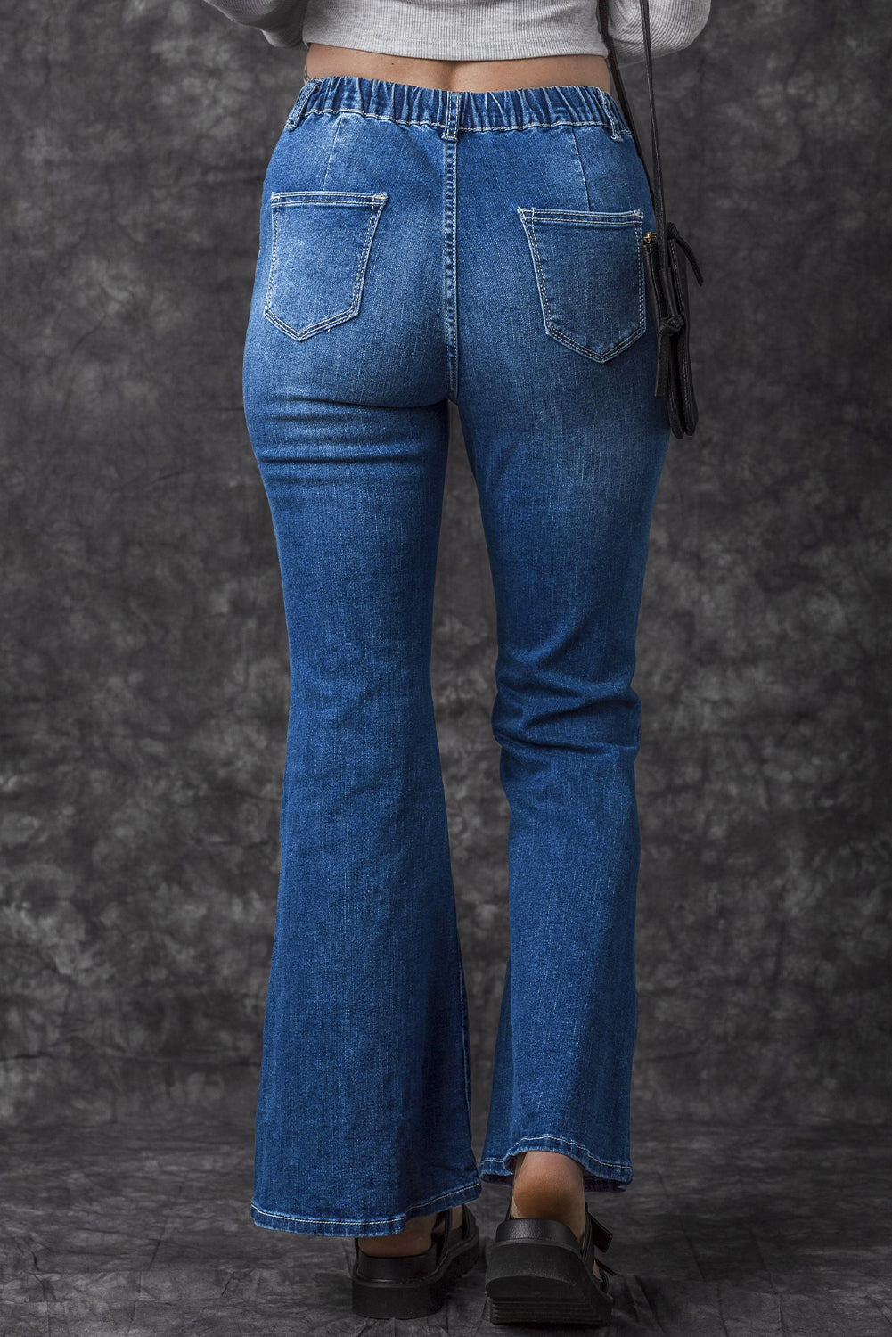 Jeans a bagliore a vita alta elastica blu