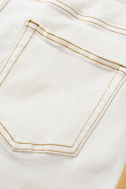 Stylish white denim shorts with asymmetrical waist