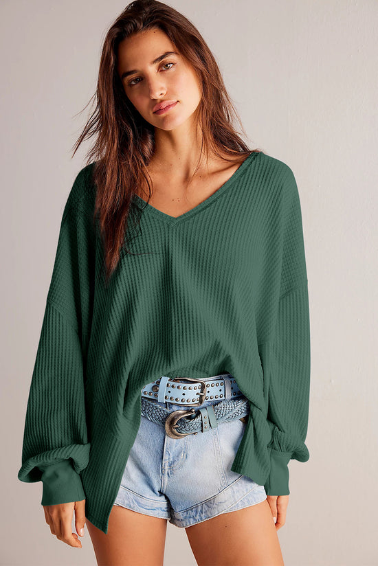 Ample blouse with long sleeves and blackish robe green v for drooping shoulders