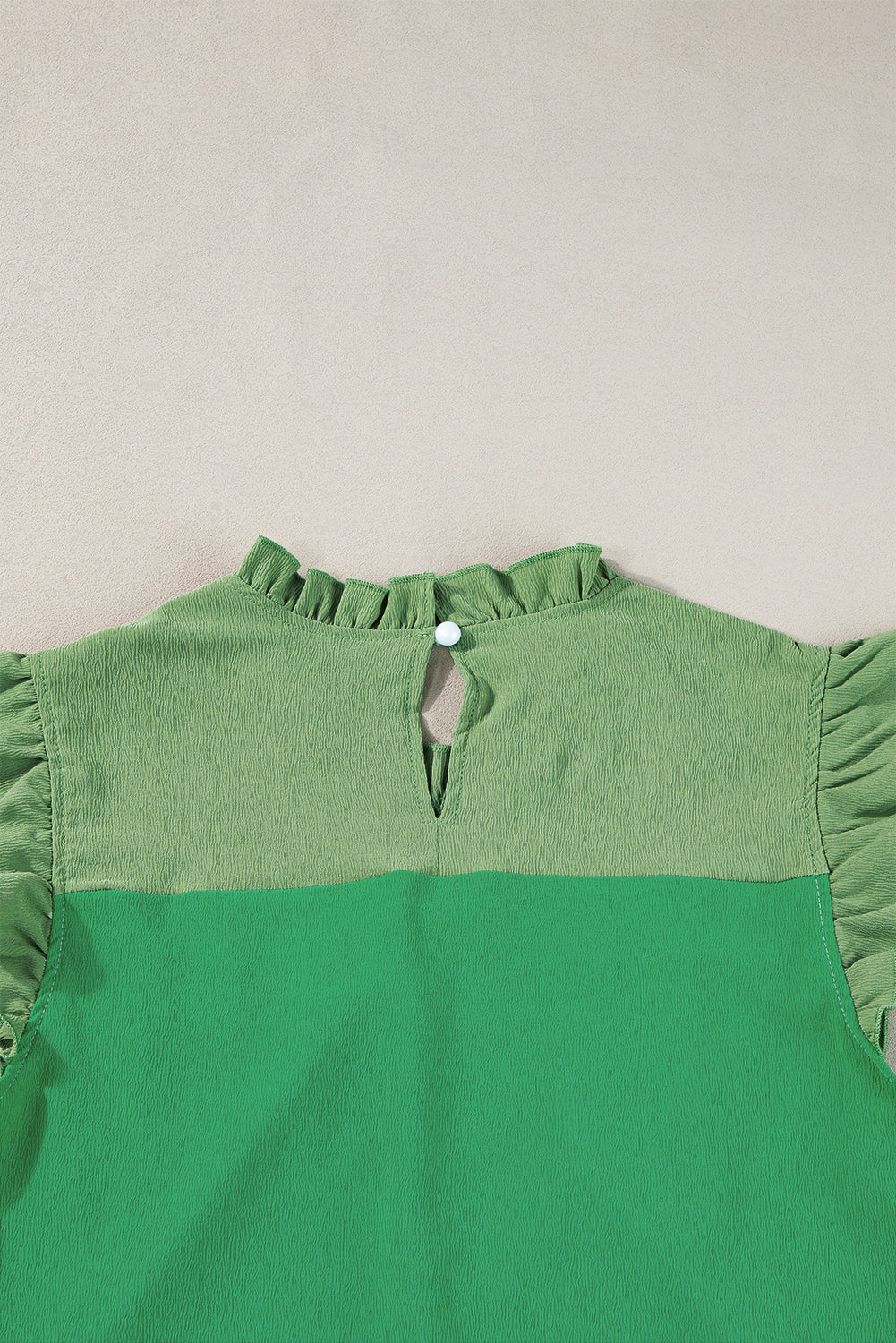 Blouse à manches à manches brillantes à deux tons vert brillant