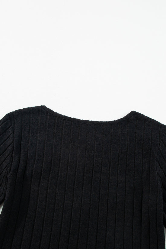 Black ribbed top with bishop sleeves and round neck