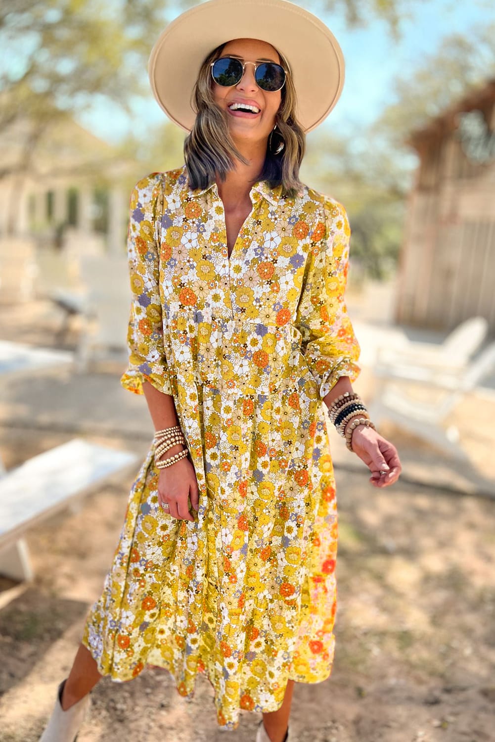 Yellow ruffled dress with long sleeves and floral collar in bohemian style