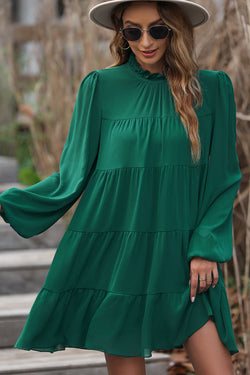 Robe verte à volants et manches bouffantes *