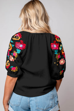 Black textured blouse with puffy sleeves and Ricrac floral embroidery