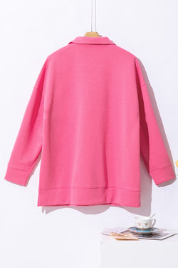 Hot pink textured sweatshirt with zip neck and kangaroo pocket