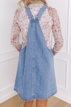 Short denim dress with wide suspenders *