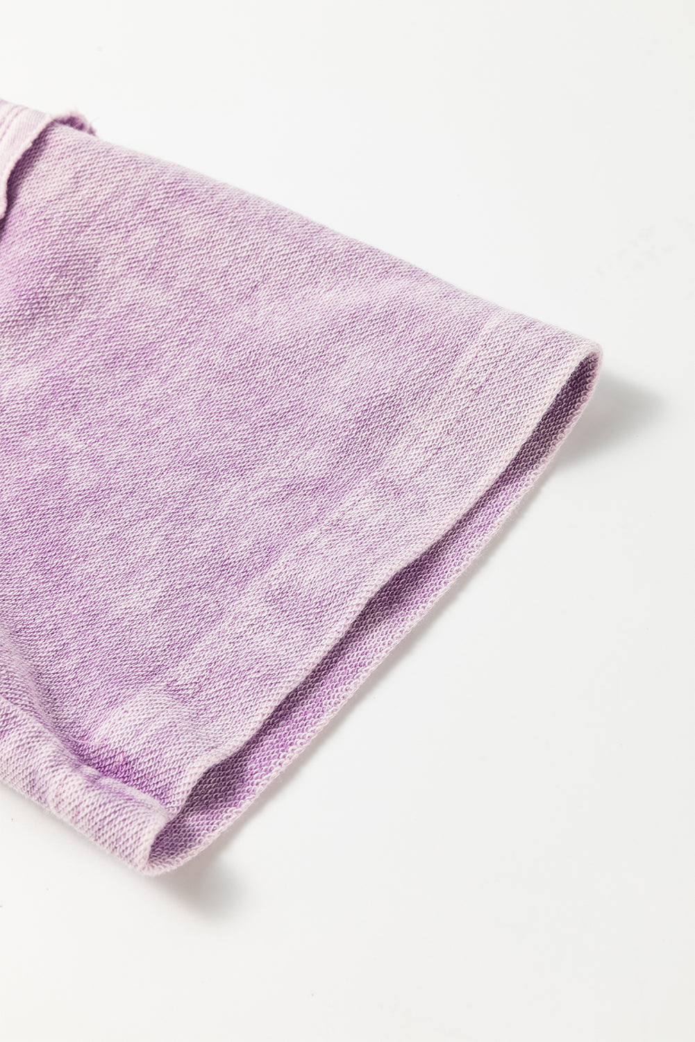 Surprised t-shirt with drooping shoulders and visible seams with mineral washed out and orchid petals