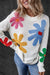 Colored white round -neck sweater with large flowers pattern