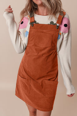 Sleeveless velvet overall dress with pockets before cinnamon units