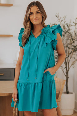 Green mini dress with ruffled sleeves and pockets