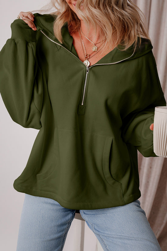 Loose-fitting half-zip hoodie with fleece-lined kangaroo pockets in moss green