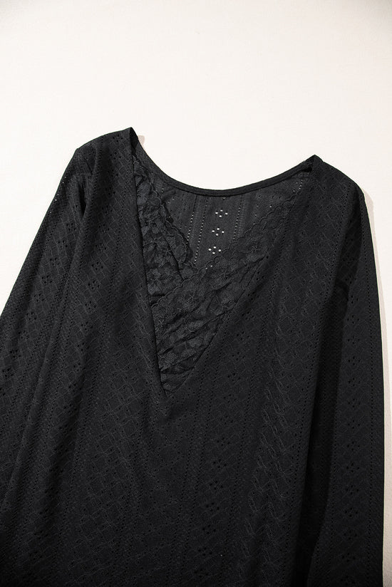 Black long sleeve top with floral lace eyelets