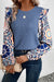 Ashleigh - Blue blouse with ruffles and floral sleeves in woven knitting with round neck