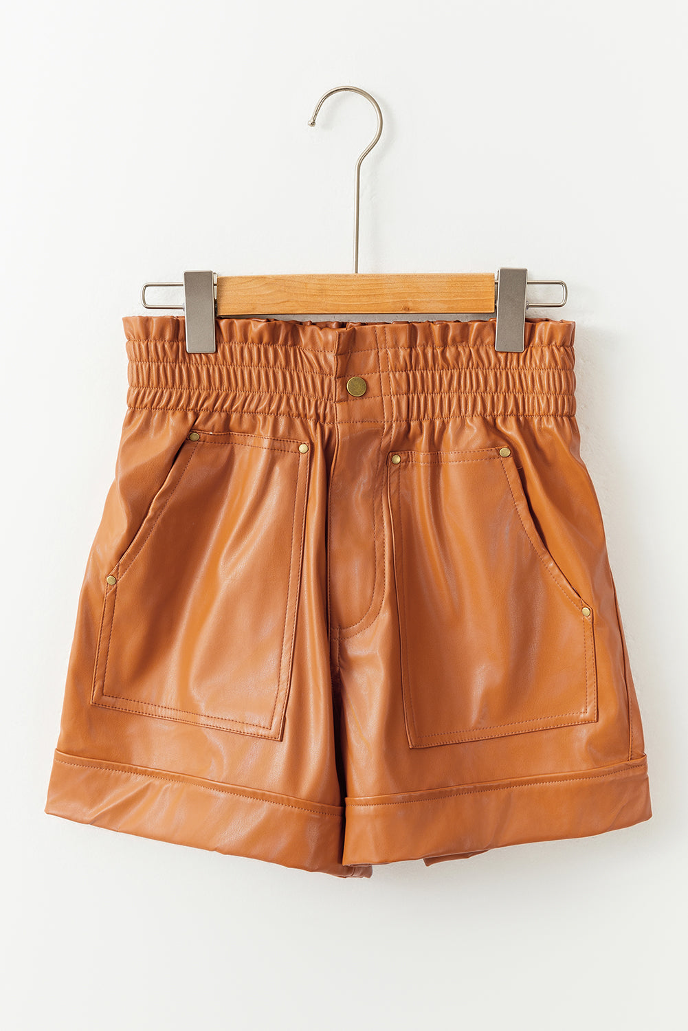 Brown faux leather high waisted shorts with patch pockets