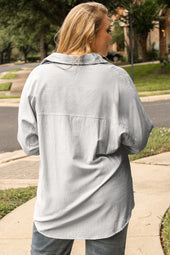 White shirt buttoned with rolled up and striped sleeves, large