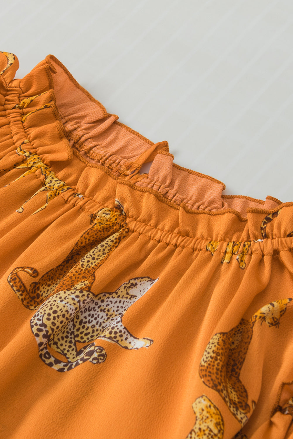 Blouse à manches à volants imprimées orange guépard