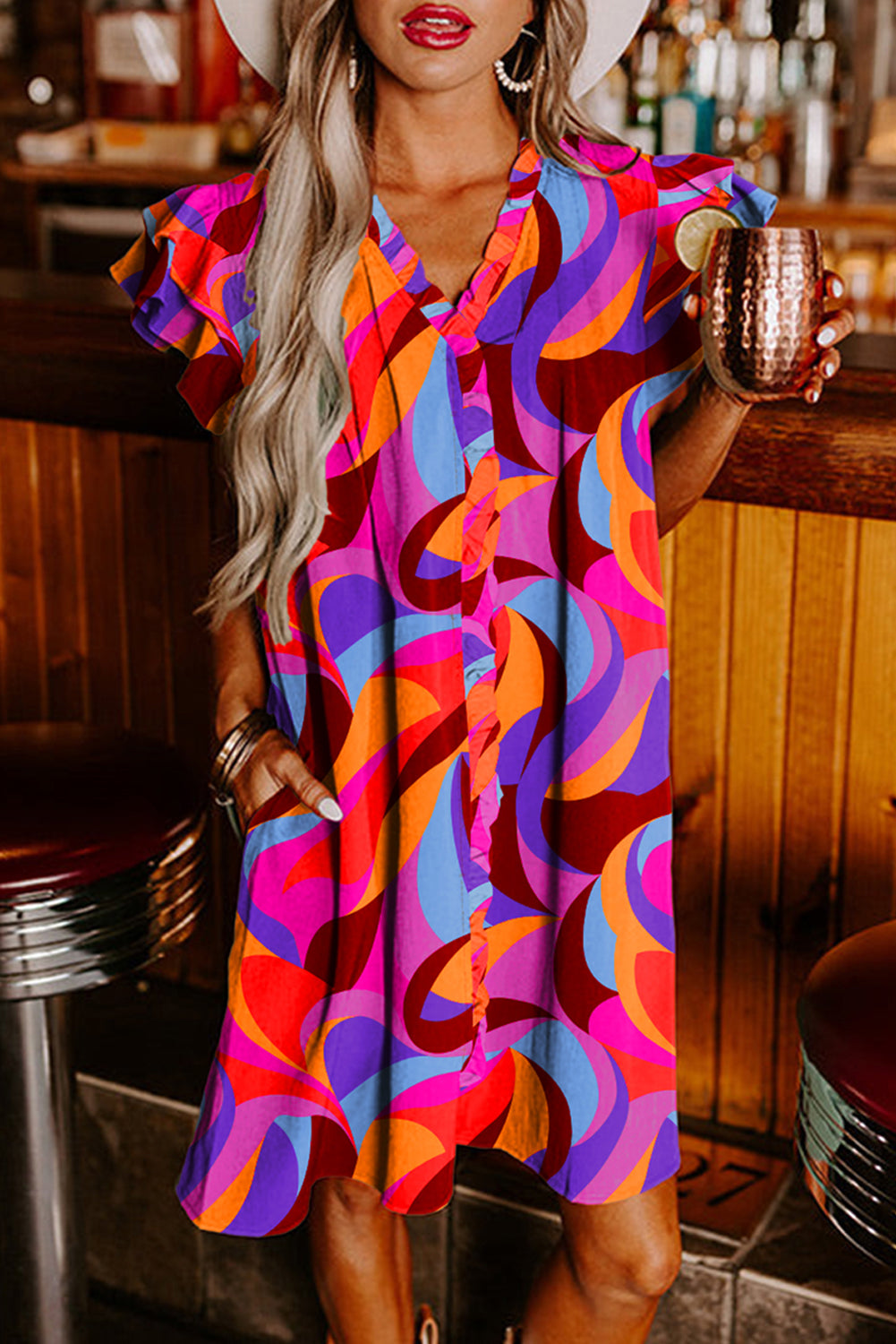 Orange straight dress with abstract print and ruffle sleeves