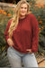 Plus size waffle knit top with exposed seams and gold flame