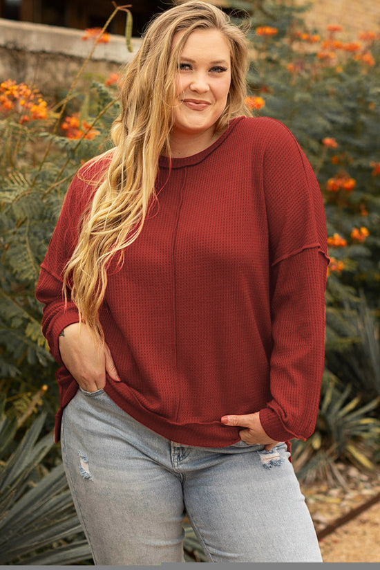 Plus size waffle knit top with exposed seams and gold flame