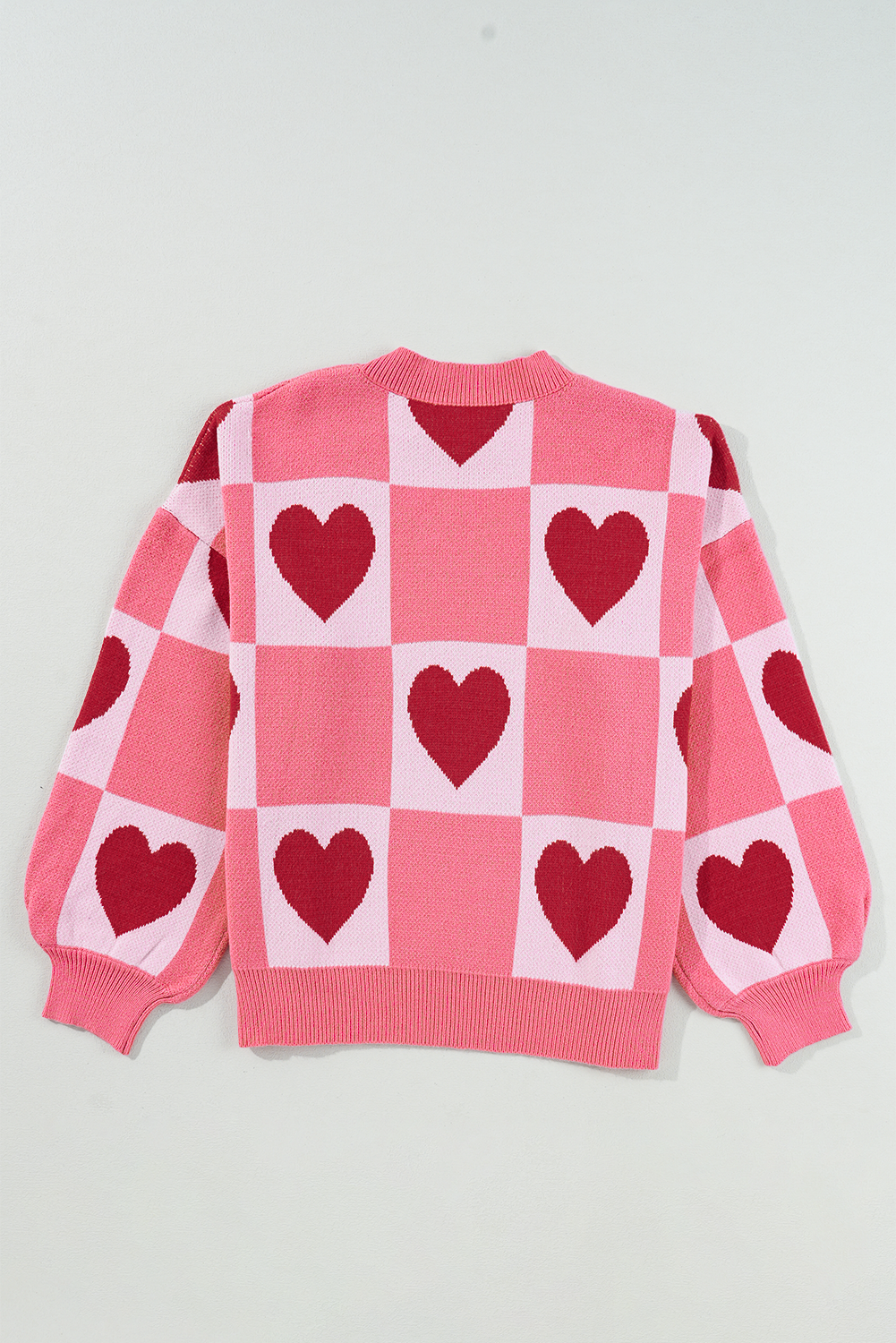 Pull de Saint-Valentin rose à manches lanternes et col montant en bloc de cœur d'amour de grande taille