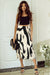 Black pleated mi-long skirt with geometric print color block