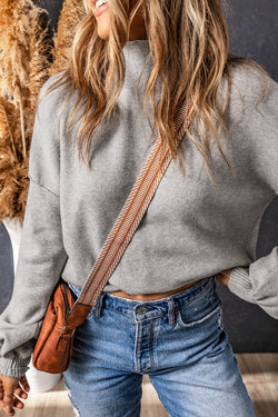 Grey turtleneck knit sweater with dropped shoulders and bubble sleeves