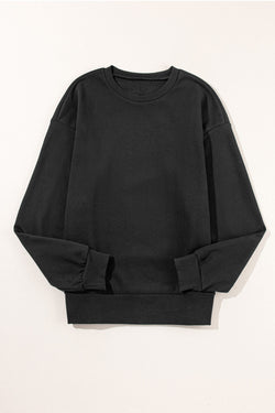 Black sweatshirt with snap buttons and side slits