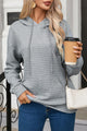 Grey quilted hoodie with kangaroo pocket and drawstring