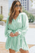 Green V-Neck Pleated Romper with Ruffles and Buttons at the Waist