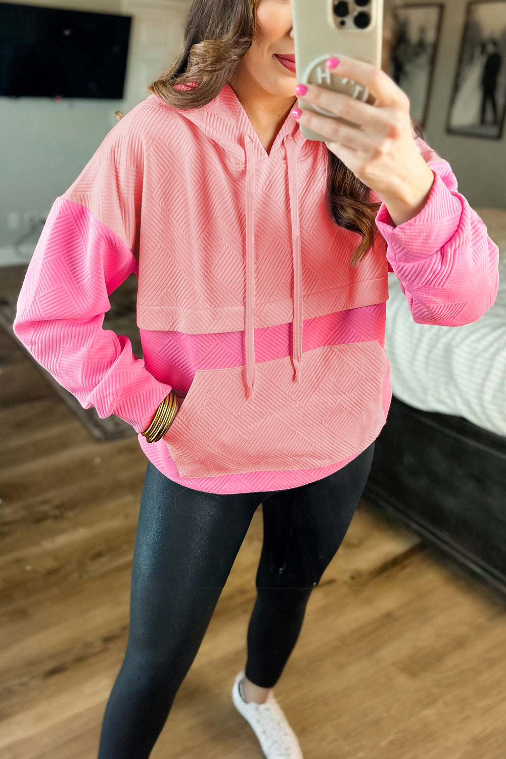 Pink textured hoodie with kangaroo pocket and dropped shoulders