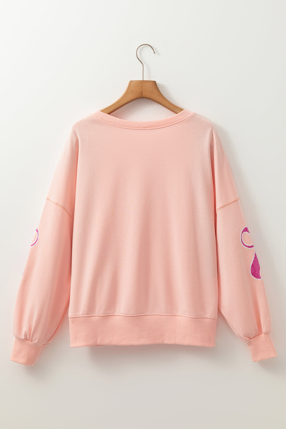 Sweat-shirt surdimensionné rose abricot à paillettes et nœud papillon à épaules tombantes