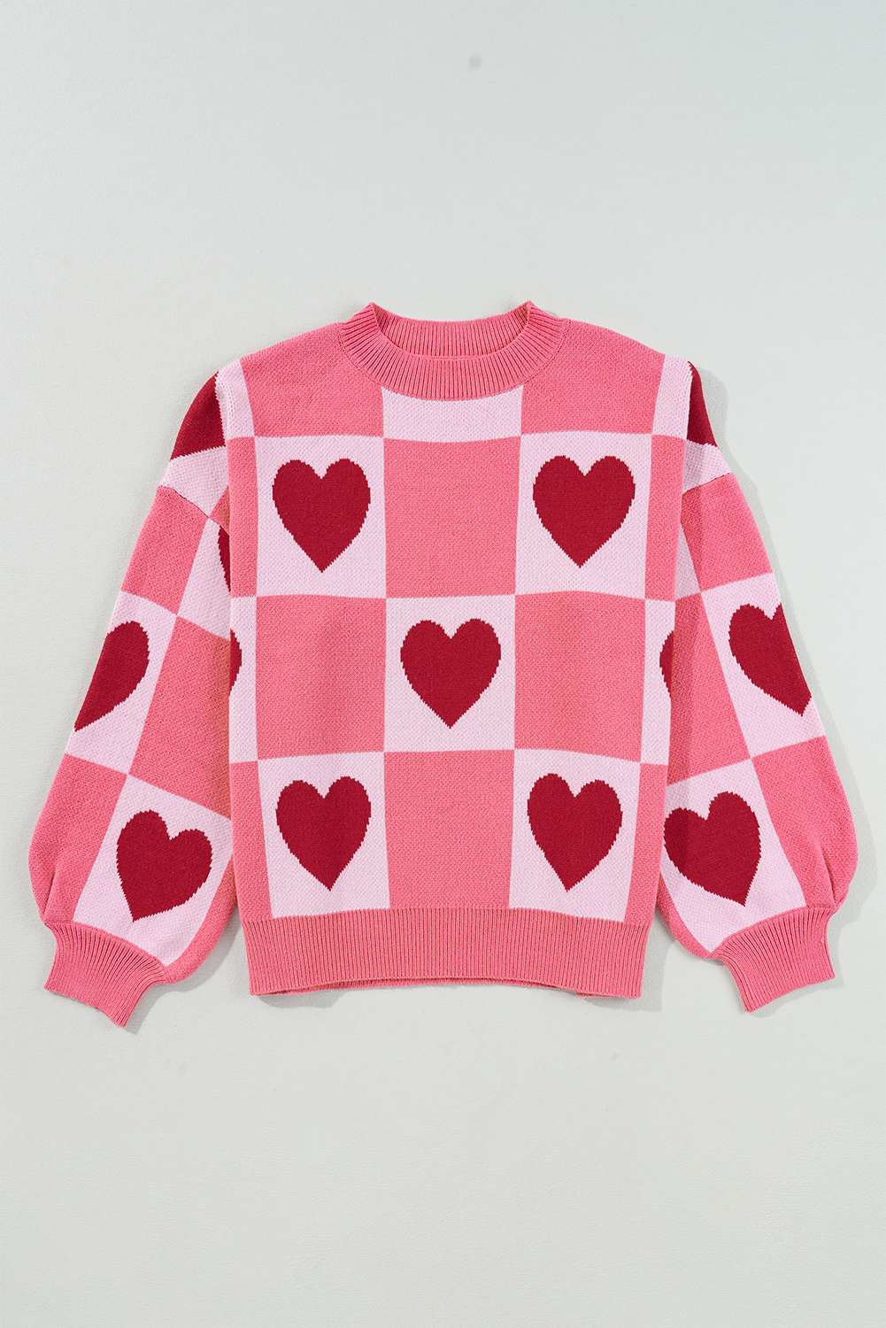 Pull de Saint-Valentin rose à manches lanternes et col montant en bloc de cœur d'amour de grande taille