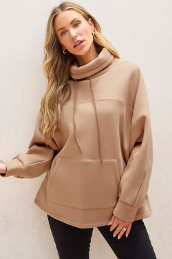 Light beige turtleneck sweatshirt with dolman sleeves and drawstring