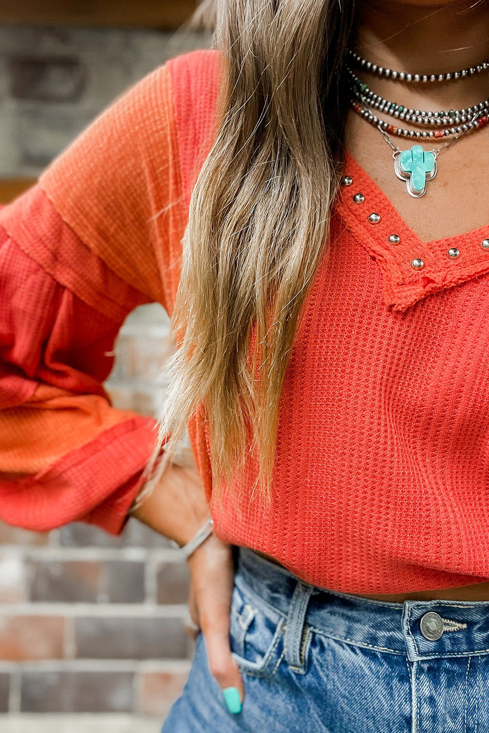 Fiery Red Studded V Neckline Exposed Seam Textured Knit Top