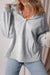 Light grey loose hoodie with half zip and fleece-lined kangaroo pockets