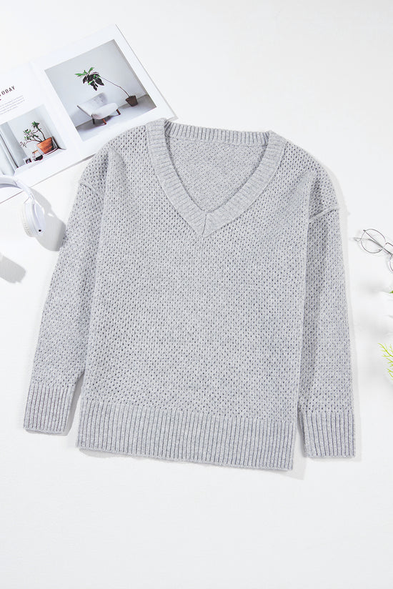 Light -gray Light gray sweater and drooping shoulders with eyelets