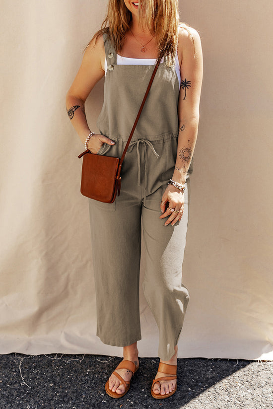 Sage green short overalls with buttoned straps and drawstring