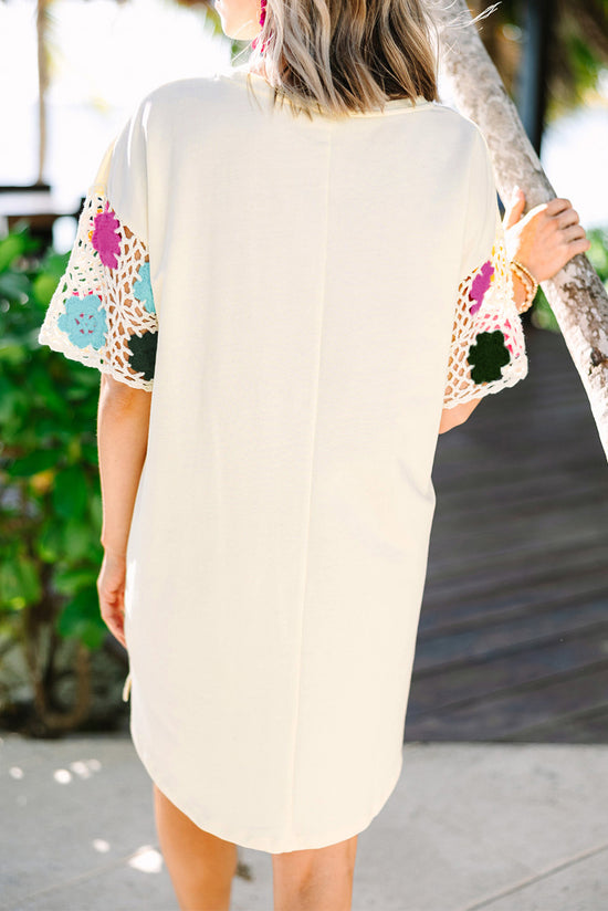 White t-shirt dress with flowering flower sleeves