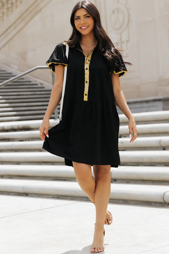 Vestido de camisa negra con mangas de burbujas y lentejuelas para el día del partido