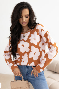 Large brown sweater with long sleeves and round neck with floral pattern