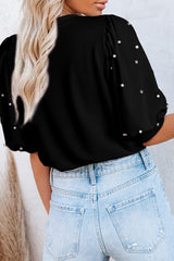 Black top with mid-long puffing sleeves with pearls and rhinestones