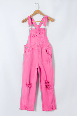 Pirouette - Distressed denim overalls with large pockets and wide legs