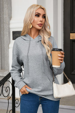 Grey quilted hoodie with kangaroo pocket and drawstring