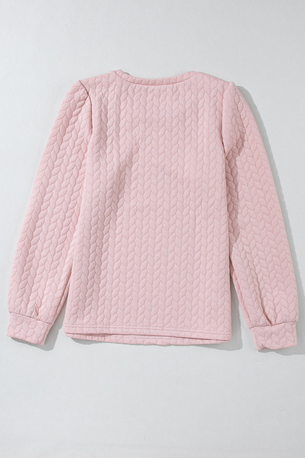 Sweat-shirt rose clair à manches bouffantes texturées et torsadées