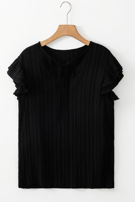 Typled black high with fluffed sleeves and v -neck